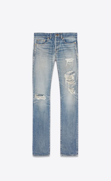 Slim jeans with holes in faded medium blue denim